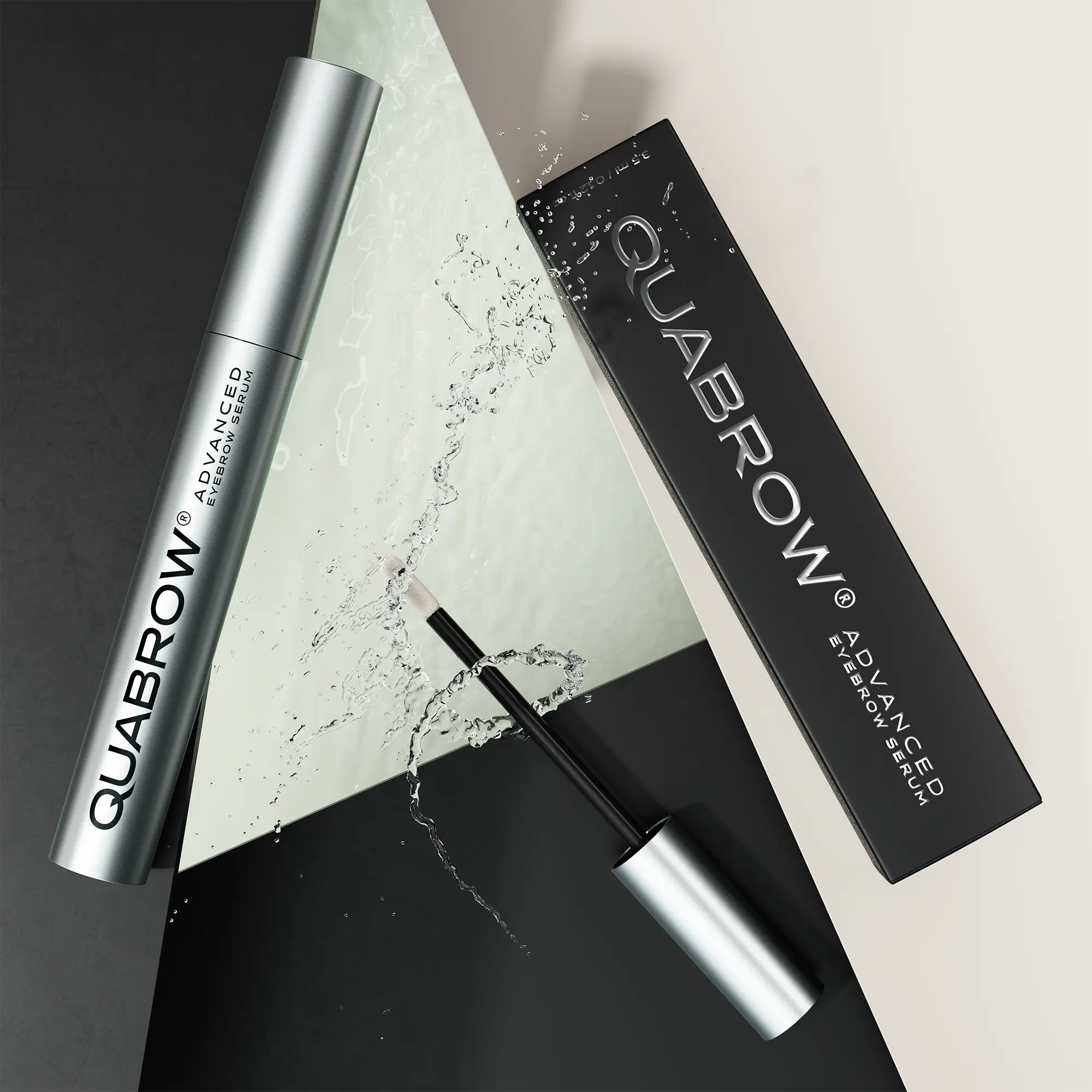 QUABROW Advanced Eyebrow Serum DUO with packaging and splash visual effect, laid on geometric surface